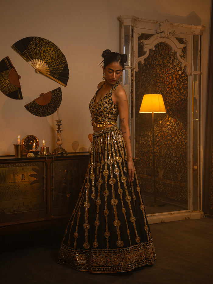 Black metal and mirror work lehenga.
