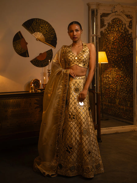 Ivory raw silk mirror work lehenga.