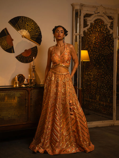 Peach-pink pink zardozi lehenga.