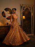 Peach-pink pink zardozi lehenga.