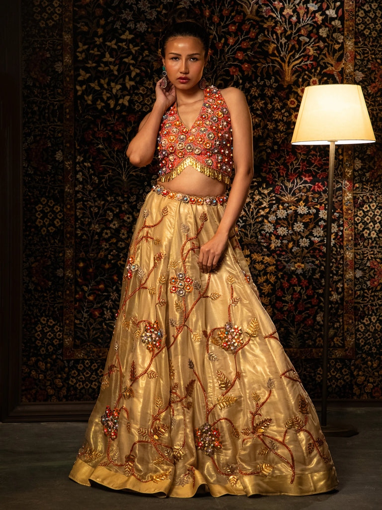 Gold metal and bead work lehenga.
